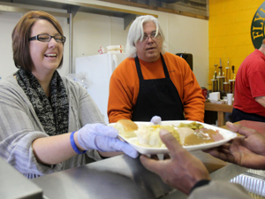 Volunteers serve holiday meal